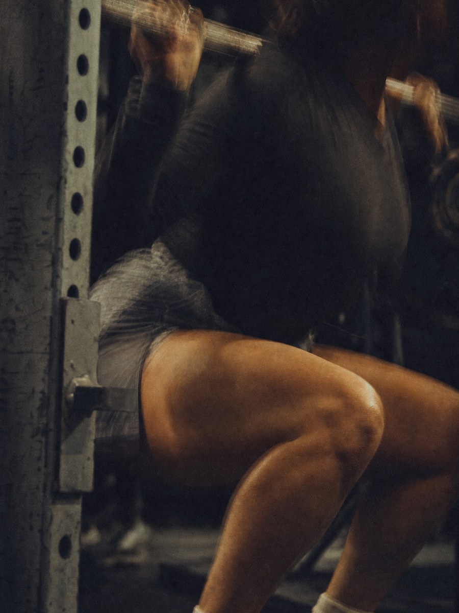 Athlete performing a barbell squat